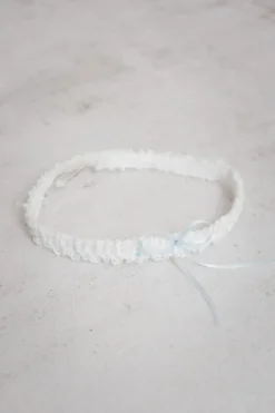 Strumpfband mit blauer Schleife und kleinem Strass-Stein
